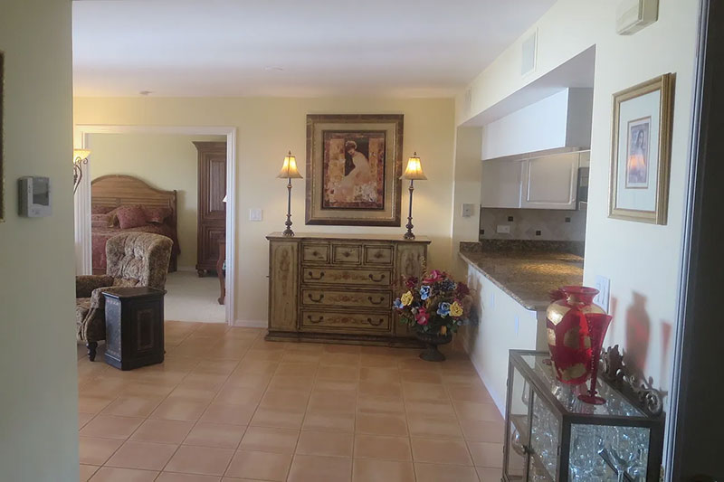 St. Pierre foyer remodel before - Diana Hall Interior Design Naples